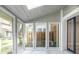 Bright sunroom featuring large windows and tiled floor at 6700 Roswell Rd # 21E, Sandy Springs, GA 30328