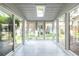 Bright sunroom with tile floors and panoramic windows offering natural light at 6700 Roswell Rd # 21E, Sandy Springs, GA 30328