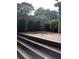 Backyard deck with decorative trees and a privacy fence at 3034 Kent Ct, Duluth, GA 30096