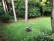 An expansive backyard with lush greenery and a fire pit, perfect for outdoor gatherings at 3034 Kent Ct, Duluth, GA 30096