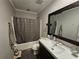 Functional bathroom with a modern vanity, large mirror, and shower-tub combination at 3034 Kent Ct, Duluth, GA 30096