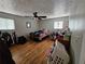 Bedroom with hardwood floors, blinds on the windows and a ceiling fan at 3034 Kent Ct, Duluth, GA 30096