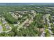 High aerial view of a sprawling suburban neighborhood with winding streets and mature trees at 3223 Thornecreek Dr, Douglasville, GA 30135