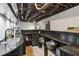 Finished basement bar area with custom lattice woodwork, shelving, and custom sink at 3223 Thornecreek Dr, Douglasville, GA 30135