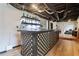 Finished basement bar area with custom lattice woodwork and drop ceiling with exposed ductwork at 3223 Thornecreek Dr, Douglasville, GA 30135