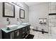 Contemporary bathroom featuring double vessel sinks, sleek cabinetry, and modern fixtures at 3223 Thornecreek Dr, Douglasville, GA 30135