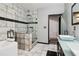 Modern bathroom with a separate shower and tub, dual sinks, and stylish tile work at 3223 Thornecreek Dr, Douglasville, GA 30135