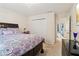Bedroom with patterned comforter, carpet and en-suite bathroom at 3223 Thornecreek Dr, Douglasville, GA 30135