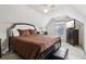 Bedroom with white walls and a brown comforter, ceiling fan, and TV on a dresser at 3223 Thornecreek Dr, Douglasville, GA 30135