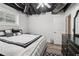 Finished basement bedroom featuring luxury bedding, modern furniture, and lots of natural light at 3223 Thornecreek Dr, Douglasville, GA 30135