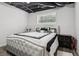 Finished basement bedroom featuring luxury bedding and dark trim at 3223 Thornecreek Dr, Douglasville, GA 30135