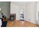 Bedroom featuring a marble fireplace, hardwood floors and an ensuite bathroom at 3223 Thornecreek Dr, Douglasville, GA 30135