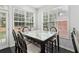 Bright breakfast nook area with table and chairs by the backyard at 3223 Thornecreek Dr, Douglasville, GA 30135