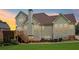 Exterior home view featuring the back of the home, wooden deck, spacious lawn, and mature landscaping at 3223 Thornecreek Dr, Douglasville, GA 30135