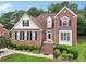 Charming two-story brick home with manicured lawn and mature trees offering great curb appeal at 3223 Thornecreek Dr, Douglasville, GA 30135
