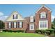 Beautiful two-story brick home with manicured landscaping and welcoming entrance at 3223 Thornecreek Dr, Douglasville, GA 30135