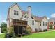 Charming home exterior with a screened-in porch and a spacious wooden deck for relaxing outdoors at 3223 Thornecreek Dr, Douglasville, GA 30135