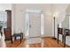 Elegant foyer with hardwood floors and a stylish entryway table at 3223 Thornecreek Dr, Douglasville, GA 30135