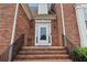 Close-up of the brick entryway and front door of the home at 3223 Thornecreek Dr, Douglasville, GA 30135