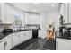 Modern kitchen with granite countertops and white cabinetry at 3223 Thornecreek Dr, Douglasville, GA 30135