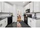 Modern kitchen featuring granite countertops and black appliances at 3223 Thornecreek Dr, Douglasville, GA 30135