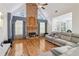 Cozy living room with stone fireplace, hardwood floors, and ample natural light at 3223 Thornecreek Dr, Douglasville, GA 30135