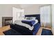 Spacious main bedroom with a fireplace, large bed and a great view of the backyard at 3223 Thornecreek Dr, Douglasville, GA 30135