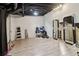 Spacious finished basement recreation room with laminate wood flooring and exposed ductwork at 3223 Thornecreek Dr, Douglasville, GA 30135