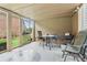 Covered screened-in back porch with outdoor seating area at 3223 Thornecreek Dr, Douglasville, GA 30135