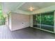 A wooden back porch looks out over the treelined property with its sliding glass doors at 460 E Kildare Nw Ave, Atlanta, GA 30318