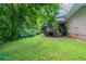 The house has a great backyard with a wooden deck on this exterior home view at 460 E Kildare Nw Ave, Atlanta, GA 30318