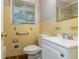 Bathroom with a single sink and yellow tiled walls at 460 E Kildare Nw Ave, Atlanta, GA 30318