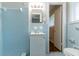 An updated and tidy powder blue bathroom features a shower, toilet, and modern sink at 460 E Kildare Nw Ave, Atlanta, GA 30318