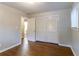 This simple bedroom has hard wood floors, a big closet, and natural light from the window at 460 E Kildare Nw Ave, Atlanta, GA 30318