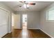 Spacious bedroom with hardwood floors and a view into the ensuite bathroom at 460 E Kildare Nw Ave, Atlanta, GA 30318