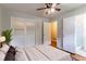 This bedroom features hardwood floors, a ceiling fan, attached bathroom, and large closet at 460 E Kildare Nw Ave, Atlanta, GA 30318