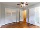 Hardwood floors, a closet, and an attached bathroom provide convenience in this bedroom at 460 E Kildare Nw Ave, Atlanta, GA 30318
