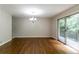 Open dining area with hardwood floors and sliding glass door leading to an outdoor deck at 460 E Kildare Nw Ave, Atlanta, GA 30318