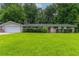 Charming single-story home with a large front yard and lush greenery, offering great curb appeal at 460 E Kildare Nw Ave, Atlanta, GA 30318