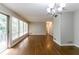 Bright living room features hardwood floors, large windows, and access to an outdoor deck at 460 E Kildare Nw Ave, Atlanta, GA 30318