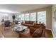 Bright living room with hardwood floors, large windows, comfortable seating and natural light at 460 E Kildare Nw Ave, Atlanta, GA 30318
