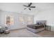 A bedroom with vaulted ceilings, carpet floors, white walls and a large bed with matching furniture at 5316 Radford Loop, Fairburn, GA 30213