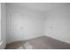 A bedroom featuring carpet floors, white walls and trim and multiple closet doors at 5316 Radford Loop, Fairburn, GA 30213