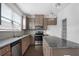 Modern kitchen features granite countertops, stainless steel appliances, and ample cabinet space at 5316 Radford Loop, Fairburn, GA 30213