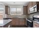 Well-appointed kitchen with stainless steel appliances, granite counters, and stylish cabinetry at 5316 Radford Loop, Fairburn, GA 30213
