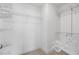 A walk-in closet with white walls and wire shelving is ready for organizing clothes and accessories at 5316 Radford Loop, Fairburn, GA 30213