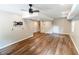 Open basement area featuring laminate flooring and a ceiling fan, great for customization at 674 Crespan Ct, Lawrenceville, GA 30044