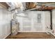 Unfinished basement area with a water heater, and exposed utilities, offering potential for customization at 674 Crespan Ct, Lawrenceville, GA 30044