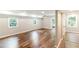 Finished basement with laminate flooring, windows, and a door leading to the outside at 674 Crespan Ct, Lawrenceville, GA 30044