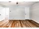A spacious bedroom showcasing wood-look flooring and neutral walls at 674 Crespan Ct, Lawrenceville, GA 30044